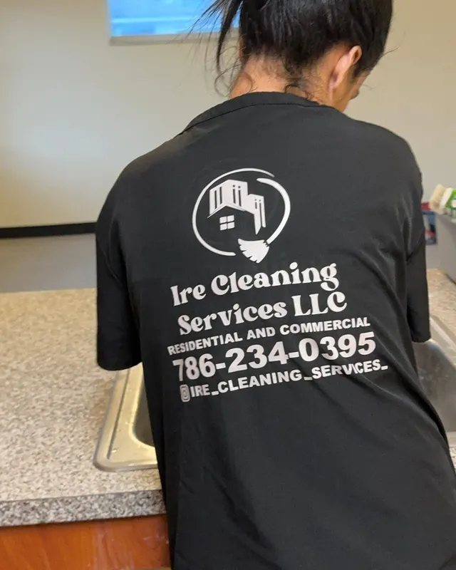 Ire Cleaning Services team member wearing a branded uniform
