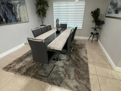 Elegant dining room with polished tile floors after a home cleaning