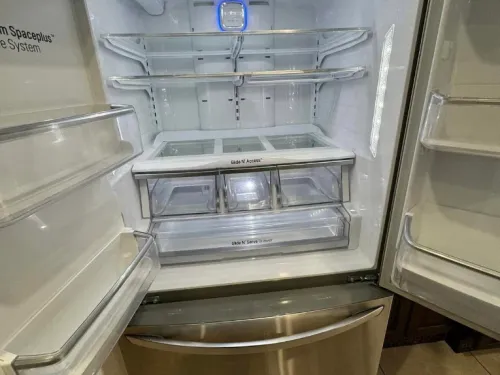 Empty, spotless refrigerator interior after a deep clean