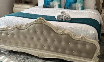 Staged Airbnb bedroom with hotel-style towels, typical of an Ire Cleaning Services Miami Beach turnover