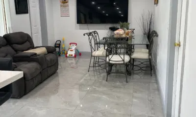 Family living room with polished tile floors after an Ire Cleaning Services house cleaning
