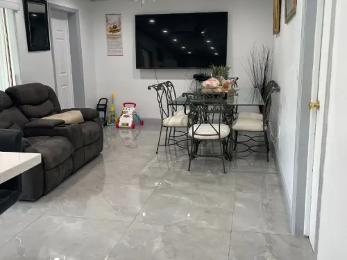 Family living room with polished tile floors after a house cleaning