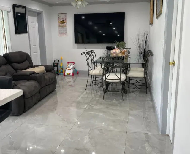 Family living room with polished tile floors after an Ire Cleaning Services house cleaning