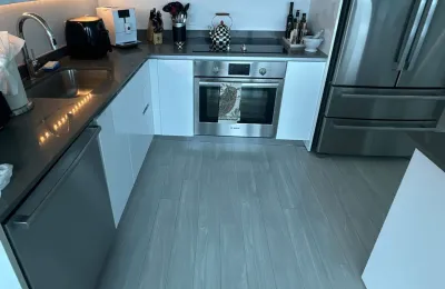 Modern high-rise condo kitchen after an Ire Cleaning Services apartment cleaning