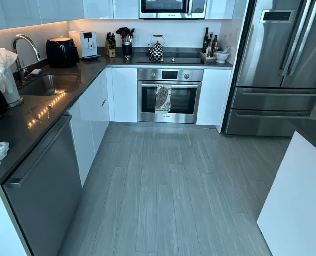 Modern high-rise condo kitchen after an Ire Cleaning Services apartment cleaning